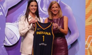 Caitlin Clark poses with WNBA Commissioner Cathy Engelbert after she was selected with the No. 1 pick by the Indiana Fever on Monday in New York.